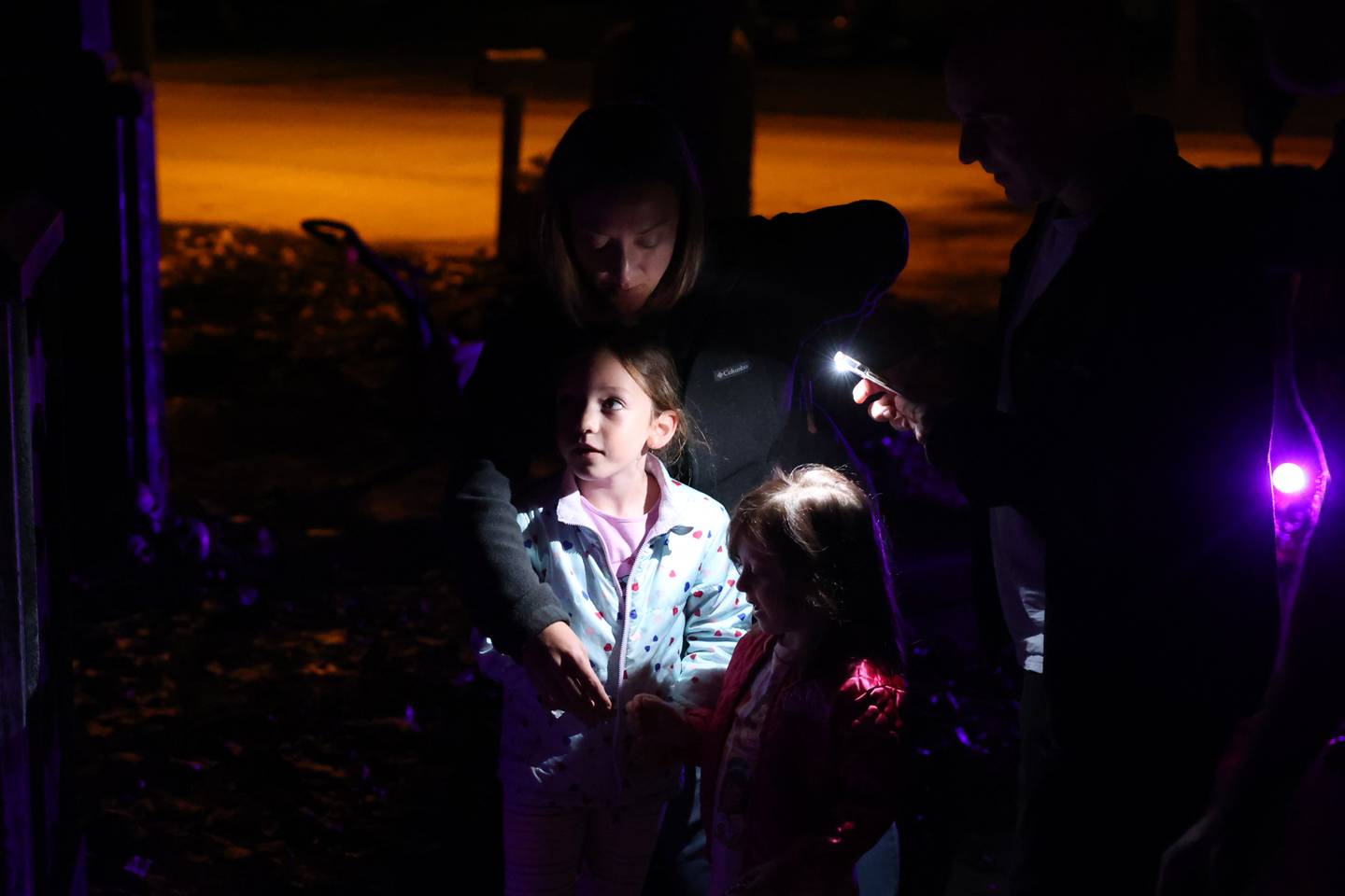 Jeff Eggener lets his neighbors, the Lipuma’s, turn on the fog machine at his “Haunted Mansion of Evil.” Tuesday, Oct. 4, 2022, in New Lenox.