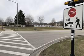 To reduce crashes at McHenry intersection, city will block turn lanes, through lane