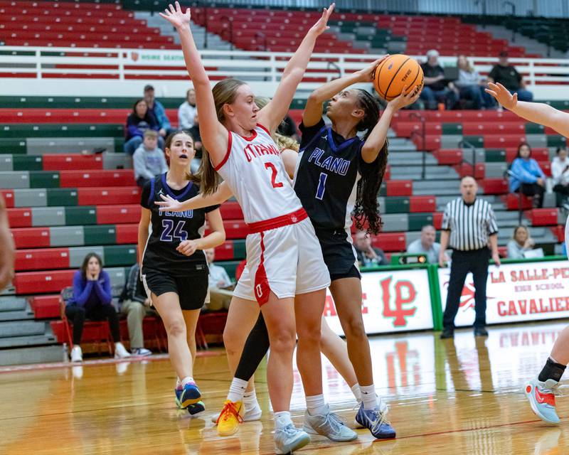 Plano's Niya Viser attempts to take a shot against Ottawa's Ashlynn Ganiere during the IHSA Class 3A Girls Basketball Regionals in Sellett Gym on February 16, 2026 at LaSalle-Peru High School.