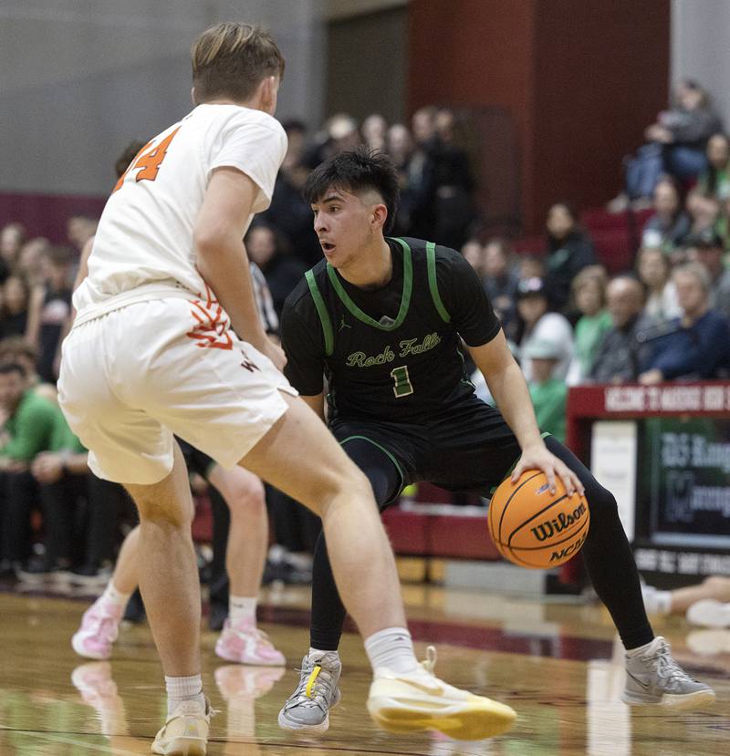 Rock Falls’ Austin Castaneda handles the ball against Winnebago’s Paxton Freeman Tuesday, March 4, 2025, during the 2A boys basketball Sectional final at Marengo.