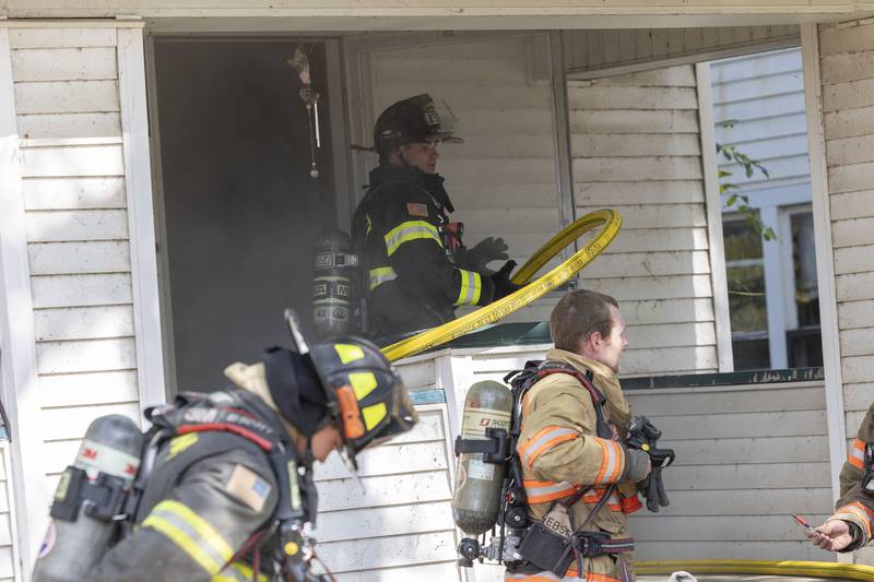 Firefighters clear out a home Tuesday, Sept. 23, 2025, during a training session in Dixon.