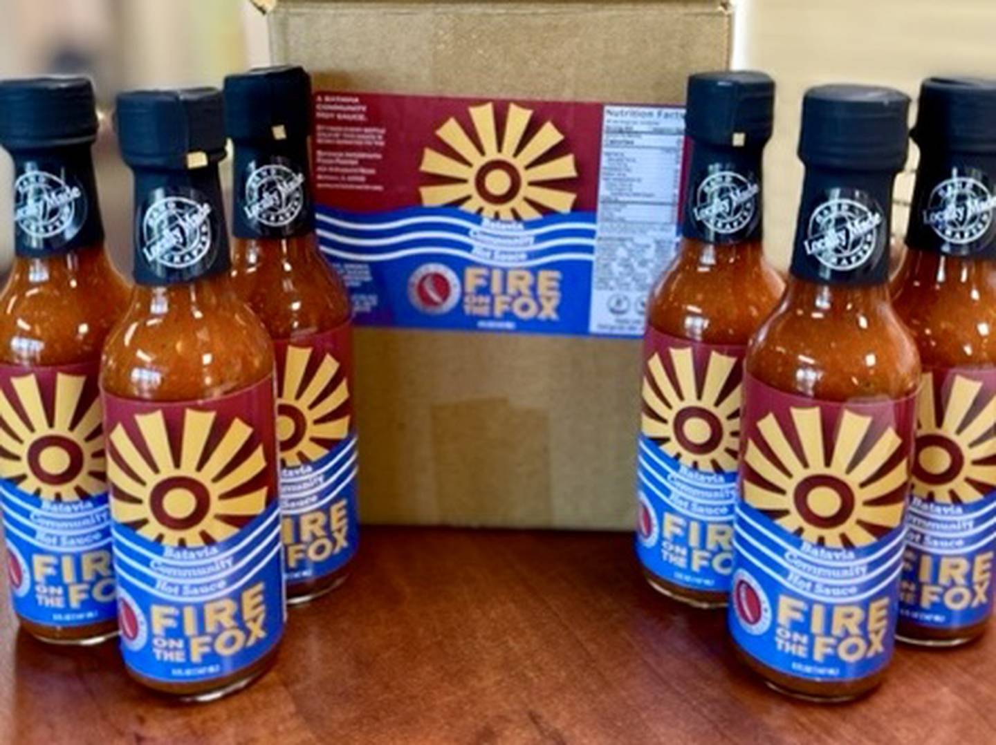 The first iteration of the Batavia community hot sauce, Fire on the Fox, created by Gindo's Spice of Life in St. Charles using peppers grown and donated by community members in 2023.