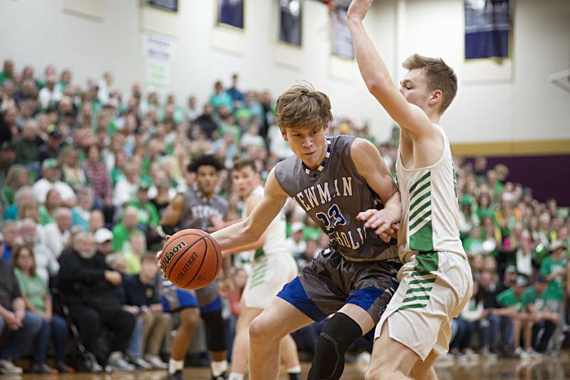 Newman's Lucas Simpson works below the basket against Scales Mound in the sectional final Friday, March 4, 2022.