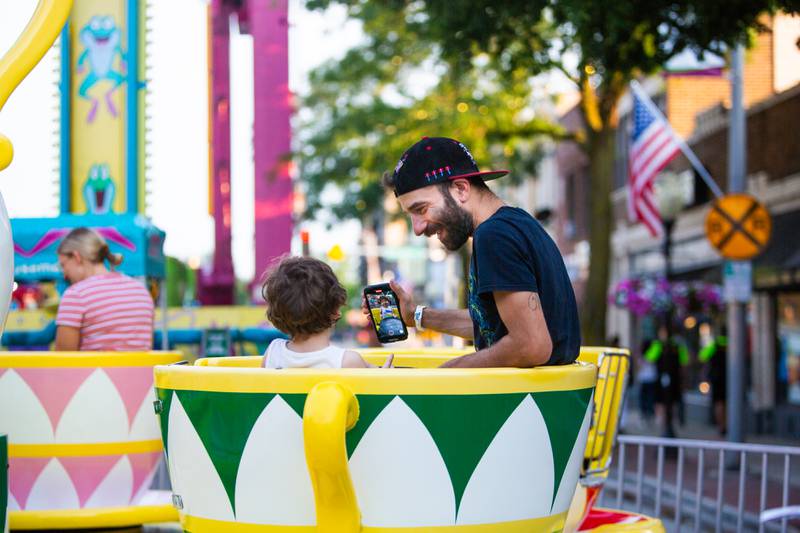 Vito Cevino of Westmont takes a photo of his son Lorenzo, 2, while they ride the teacups at The Taste of Westmont on Saturday, July 13.

Suzanne Tennant/For Shaw Local News Media