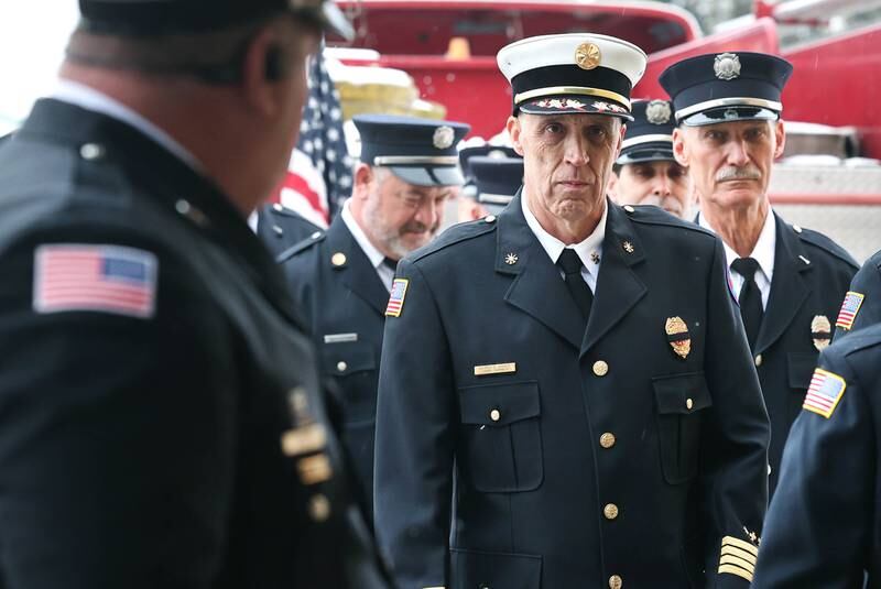 Active and retired Sycamore firefighters file in Saturday, Jan. 6, 2024, during the visitation for Sycamore firefighter/paramedic Bradley Belanger at the Sycamore Park District Community Center. Belanger, 45, who worked with the Sycamore Fire Department for more than two decades, died Friday, Dec. 22, after a yearlong battle with cancer.