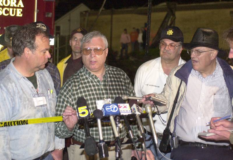 Former Utica Fire Chief Dave Edgcomb, former Utica mayor Fred Esmond, former La Salle County Sheriff Tom Templeton address local media Joe Hogan (far right) and other Chicago media on the evening of the tornado on Tuesday April 20, 2004 downtown Utica.