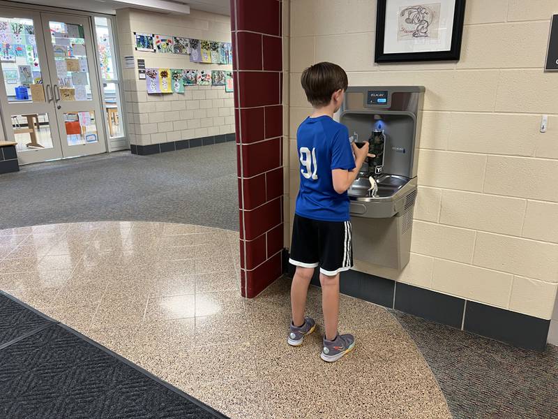 A student at Williamsburg Elementary School fills his water bottle at a water bottle filling station made possible by a $6,345 donation from the school’s PTO. The donation allowed for a filling station to be placed at each of four wings of the school.