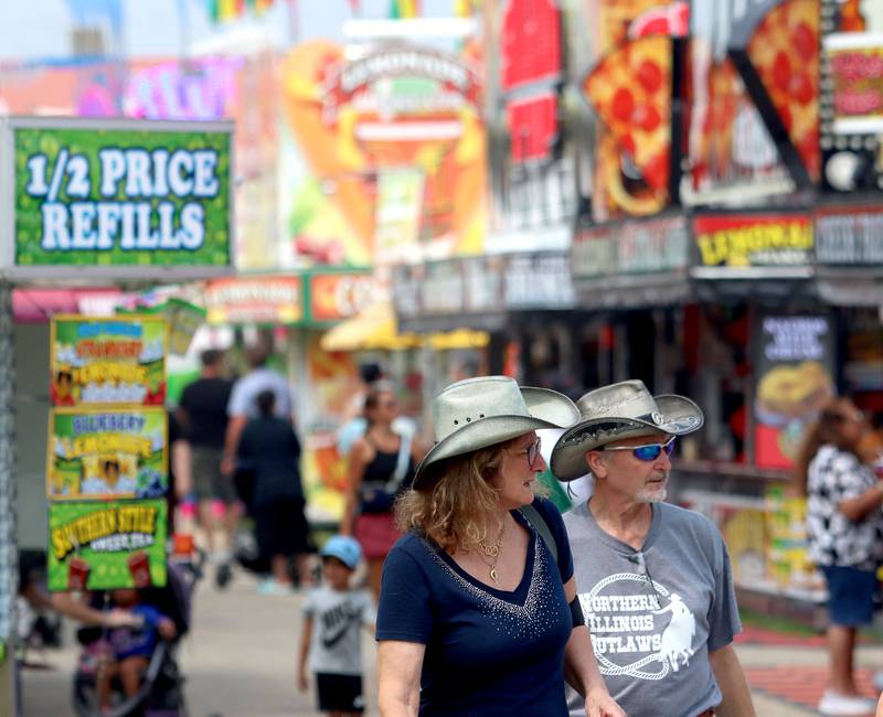 Fairgoers walk on the final day of the 2025 McHenry County Fair in Woodstock on Sunday, August 3, 2025.