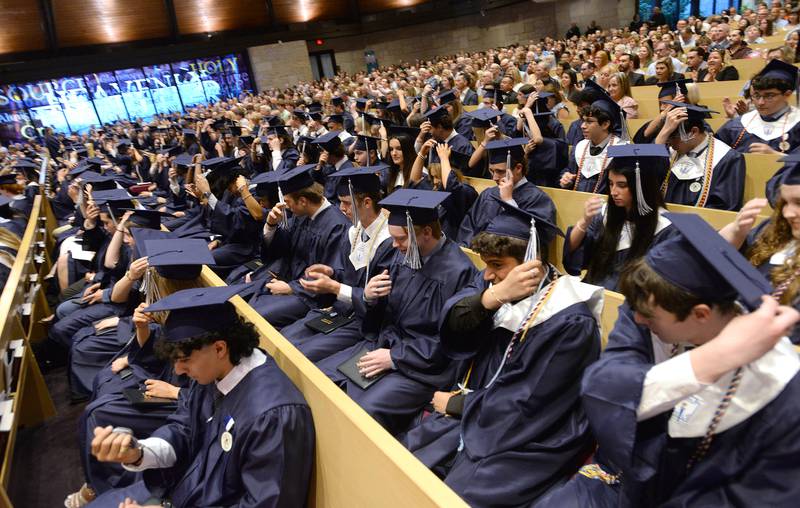 Nazareth graduates turn the tassel after receiving their diplomas during the mass and graduation held on Sunday, May 18, 2025 at Christ Church of Oak Brook.