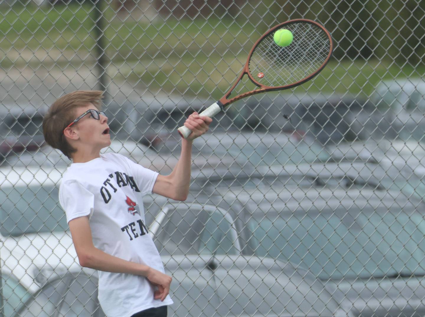Ottawa's Bentley Thumm returns a serve on Tuesday, April 21, 2026 in the Henderson-Guenther Tennis Facility at Ottawa High School.