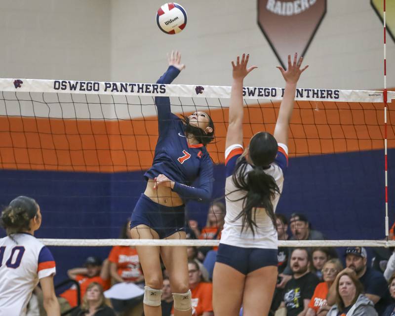 Oswego's Hannah Herrick (7) goes up for one of her many kills during volleyball match between Romeoville at Oswego. Oct 16, 2025.