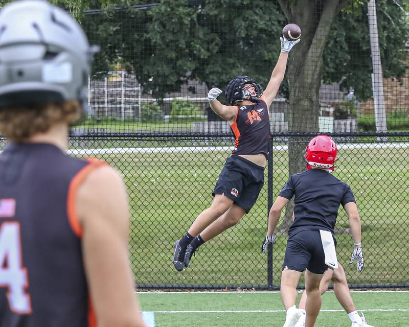 Miinooka's Jackson Miranda fully extends for a touchdown reception thrown by Zane Caves in the back of the end zone during the Downers Grove South 7 on 7 football tournament, July 12, 2025  in Downers Grove.