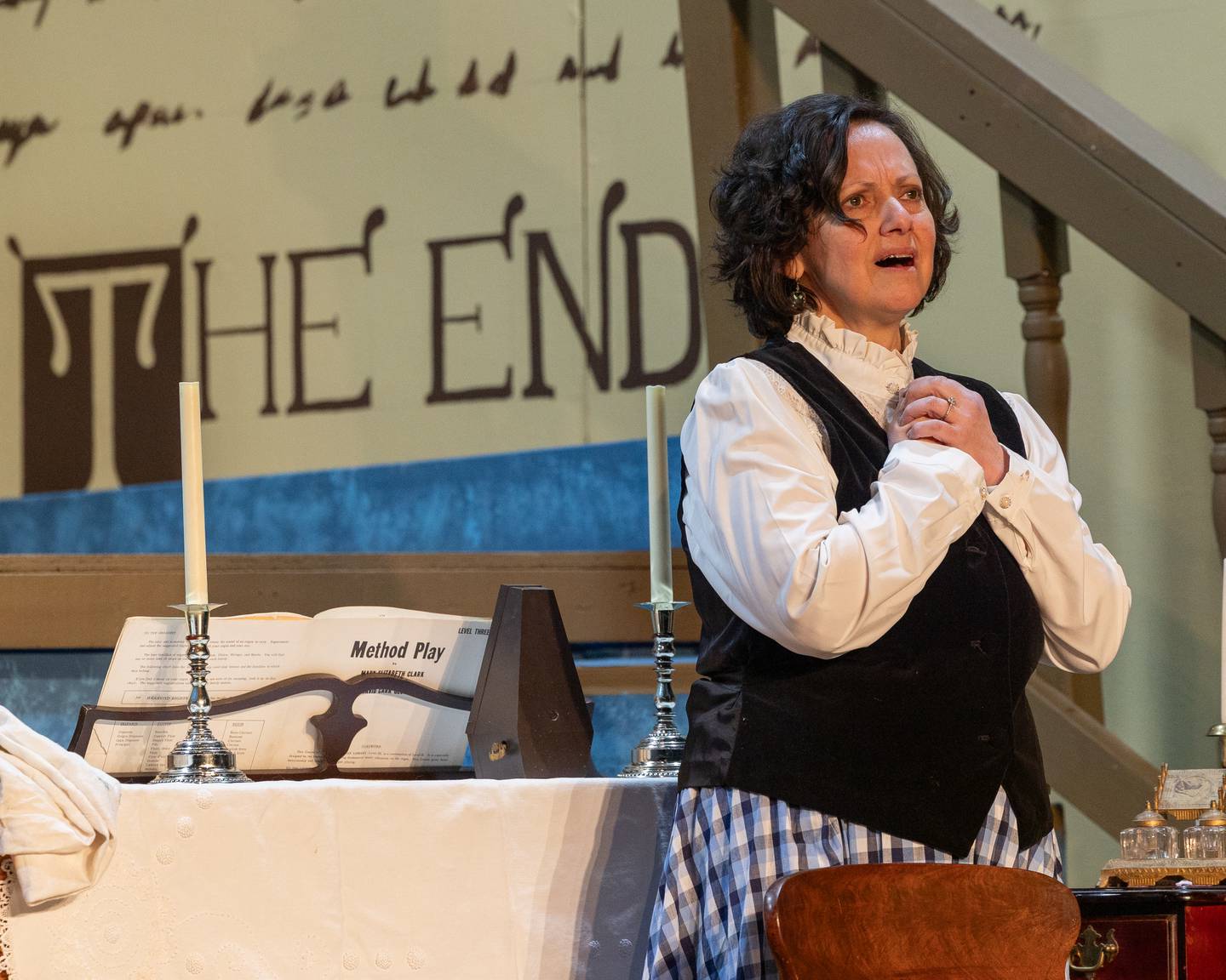 'Marmee March' played by Suzannah Walter embraces self in song on stage during performance of 'Little Women' on Tuesday, January 28, 2026 at Stage 212 in LaSalle. The play will be shown starting February 6th going through February 15th.
