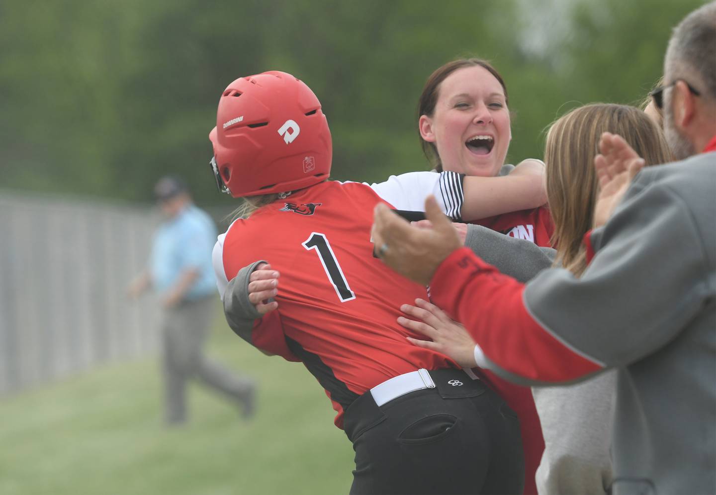 Forreston head coach Kim Snider gives Rylee Broshous big hug after she hit a walk-off home run in the bottom of the 12th inning to give the Cardinals a 2-1 win over Pearl City at the 1A South Beloit Sectional on Tuesday. Forreston will play in the sectional final on Friday.