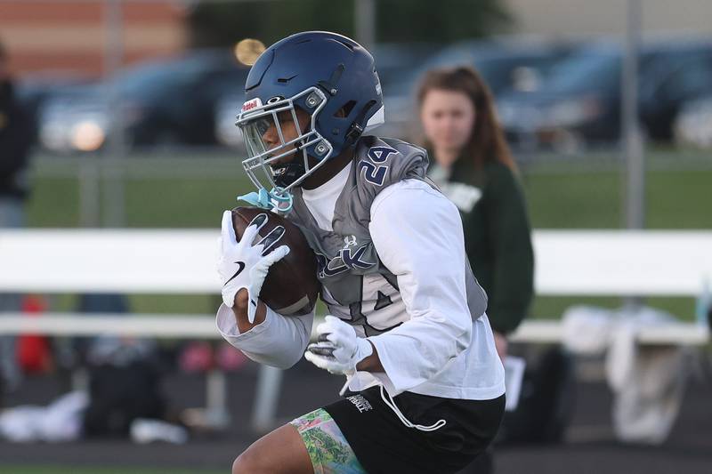 Oswego East’s Lenair McClain runs a drill at the IHSA Southwest Suburb Showcase combine on Thursday, May 7, 2026 at Plainfield North High School.