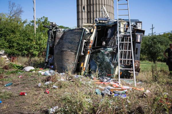 Garbage truck goes over embankment, overturns, shutting down Cary Algonquin Road