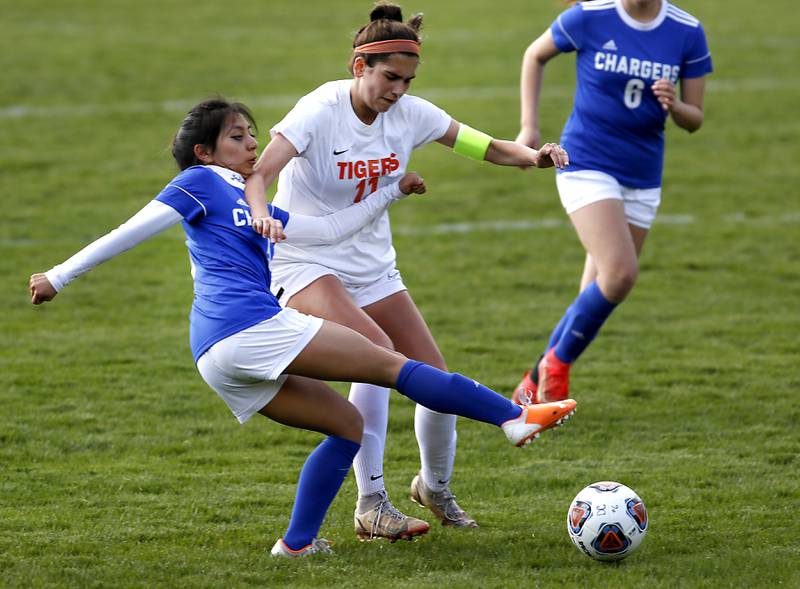 Dundee-Crown's Daisy Rivas tries to kick the ball away from Crystal Lake Central's Kaitlin Gaunaurd during a Fox Valley Conference soccer match Tuesday April 26, 2022, between Crystal Lake Central and Dundee-Crown at Dundee-Crown High School.