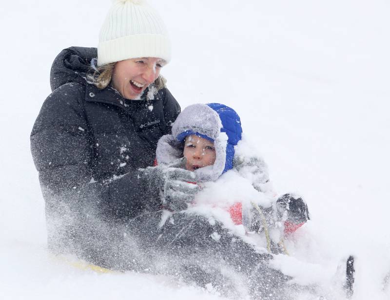 Abigail Walsh of Crystal Lake sleds with her son Holden, 2, at Veteran Acres on Sunday, Dec. 7, 2025 in Crystal Lake.