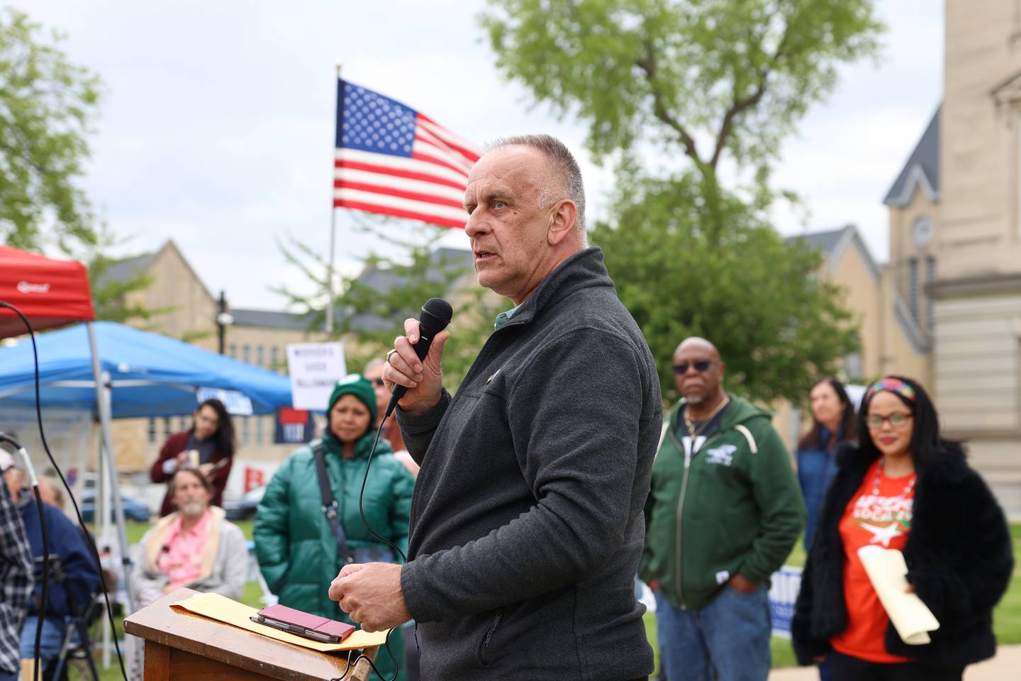Larry Kerkstra, Kankakee County Board member, speaks during the May Day Strong rally at the Kankakee County Courthouse on May 1, 2026, as part of a national day of action.