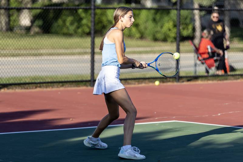 Joliet Catholic Academy’s Juliana McClowry competes in varsity singles tennis during a match against Joliet Township at Joliet West on Sept. 29, 2025.