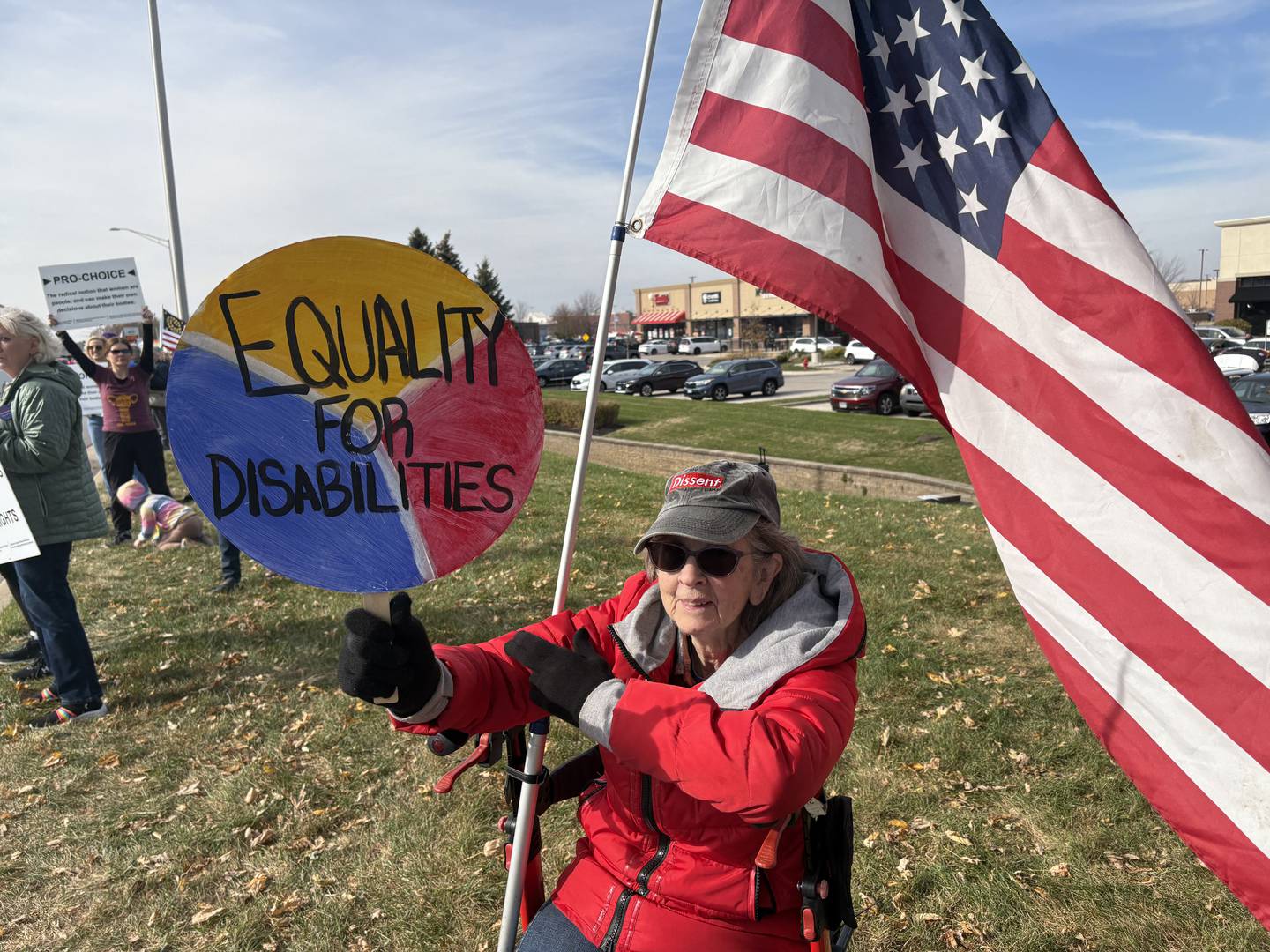 Teri Lancaster holds a sign reading "equality for disabilities" at a pro-Harris rally Nov. 2, 2024.