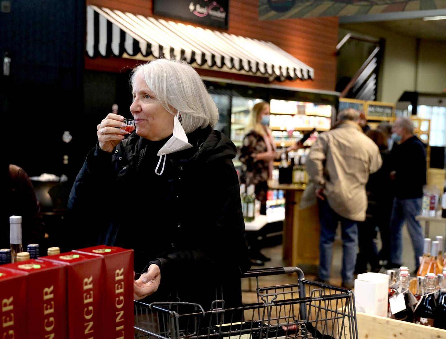 Laura Stewart of Geneva sips a sample of wine during the final wine tasting event at the Blue Goose Market in St. Charles. President and CEO Paul Lencioni announced the store was closing after more than 90 years in business in early February.