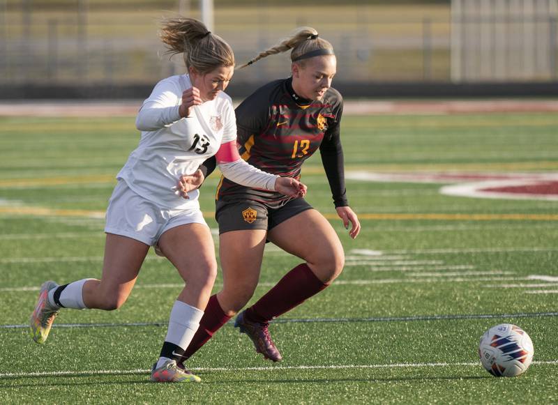 Prairie Ridge's Ellie King, left, and Richmond-Burton's Jordan Otto compete for a loose ball during their game on Wednesday, April 5, 2023 at Richmond-Burton High School in Richmond. Ryan Rayburn for Shaw Local