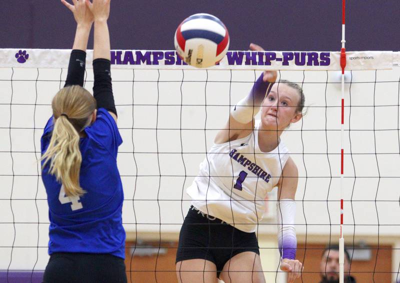 Hampshire’s Elizabeth King sends the ball over the net against Woodstock in varsity volleyball tournament action on Saturday, Sept. 21, 2024, at Hampshire High School in Hampshire.