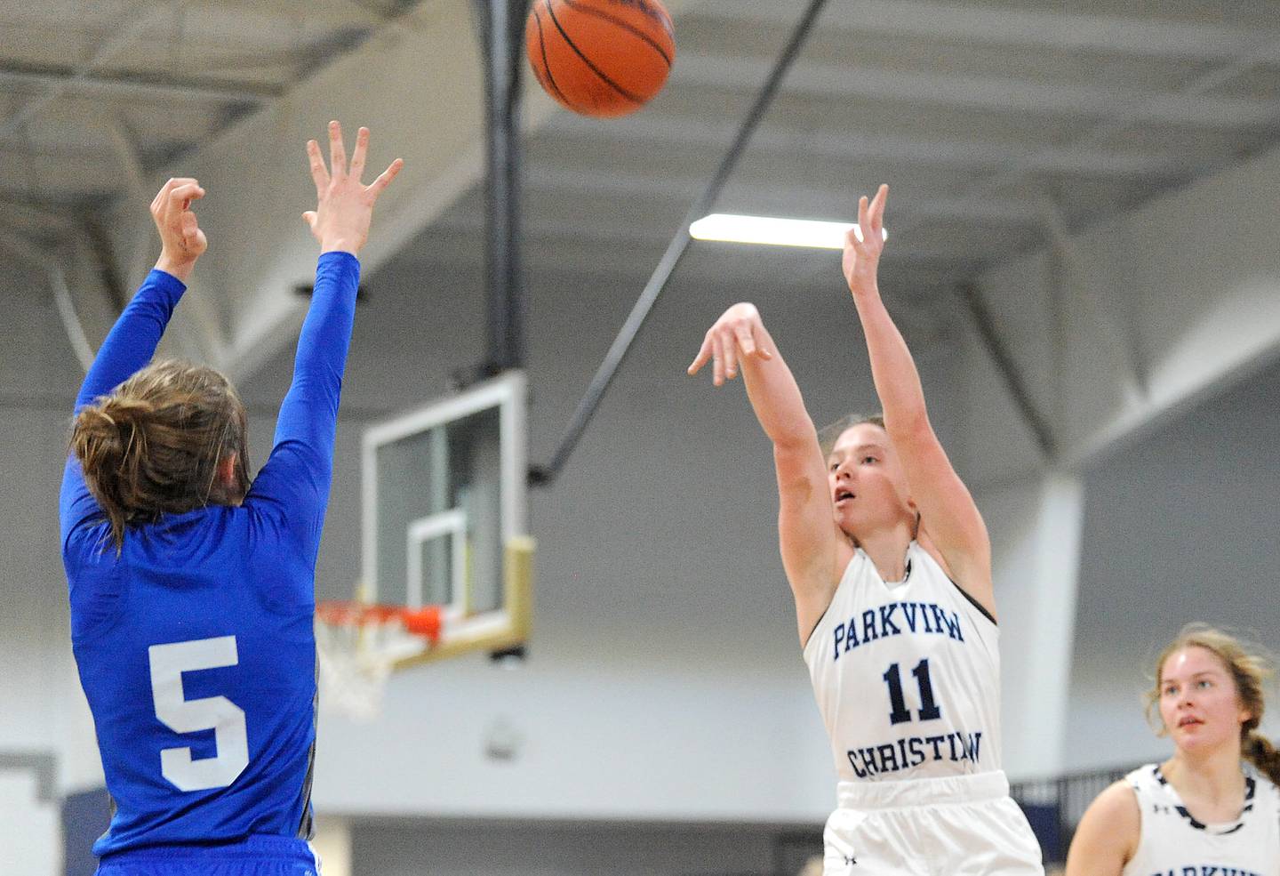 Parkview Christian's Gracie Lambes (11) shoots and drains a three-point shot over Westlake Christian defender Juliet Sigurnjak (5) during a girls' basketball game at Parkview Christian Academy on Tuesday, Dec. 20, 2022.