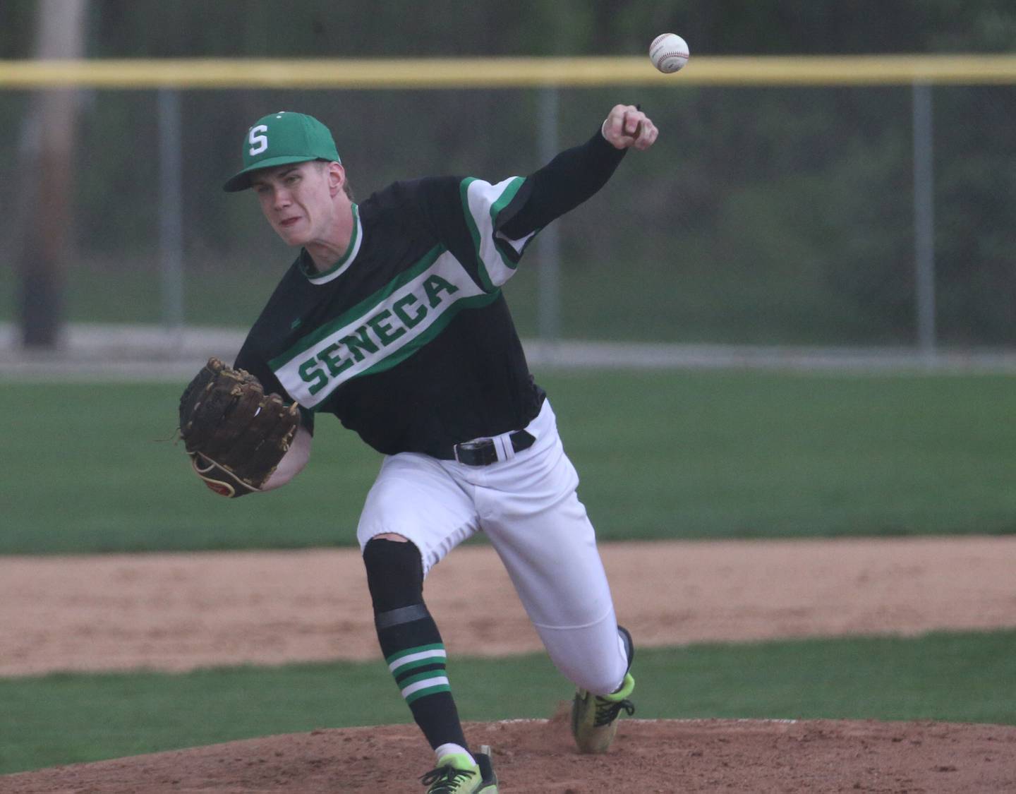 Seneca's Paxton Giertz delivers a pitch to a Marquette batter in a game last season at Masinelli Field in Ottawa.