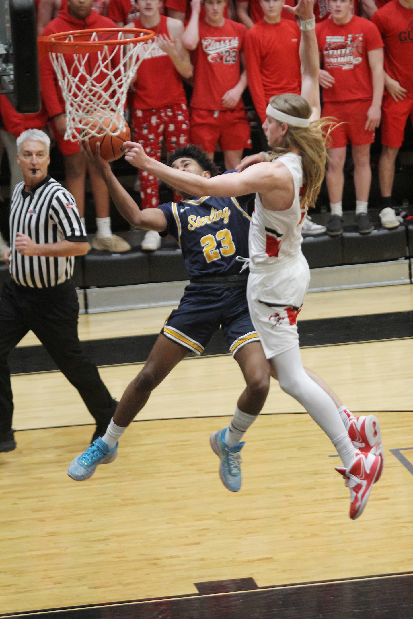 Sterling's Kaedon Phillips (23) shoots against Metamora's Ethan Kizer in the Class 3A Galesburg Sectional semifinals on Wednesday, March 1, 2023.