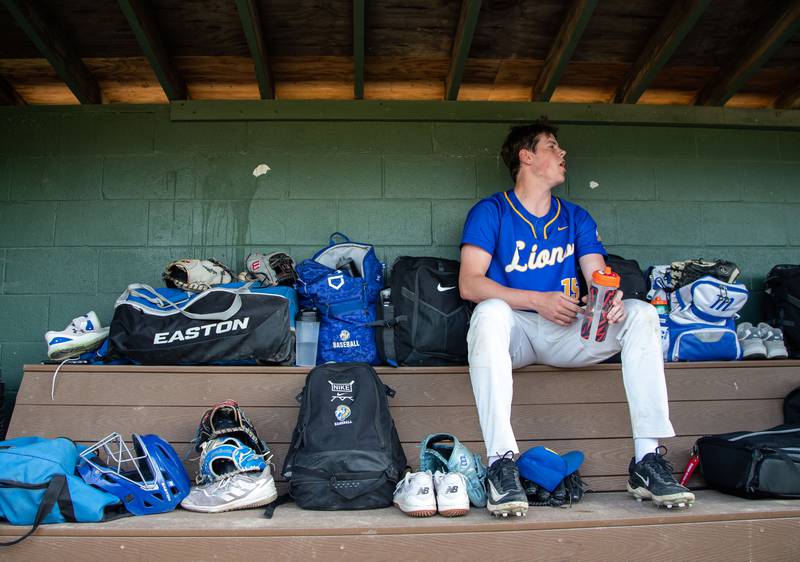 Lyons Township pitcher Tucker King rests between innings during a game between Downers Grove North in Downers Grove on Monday, May 12, 2025.