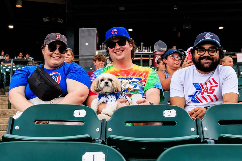 Maddi Gelsinon, Mike Gelsinon, Arugula, and Aaron Lowe enjoy the Joliet Slammers Dog Day event, presented by University of St. Francis, on Aug. 10, 2025.