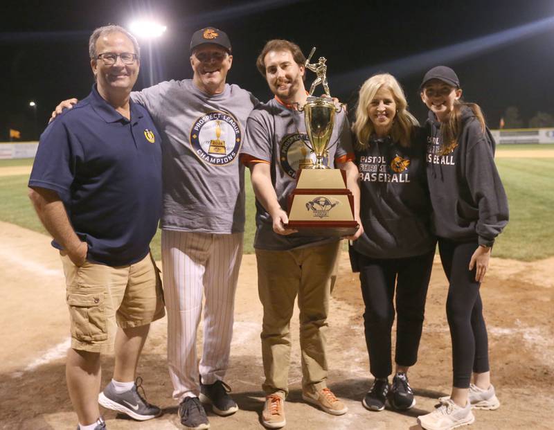 (From left) Peru mayor Ken Kolowski, Pistol Shrimp field manager John Jakiemiec, Lucas Burris radio announcer, general manager June Keeley, and content creator Emme Bottom pose for a photo with the Prospect League trophy on Wednesday, Aug. 7, 2024 at Schweickert Stadium in Peru.