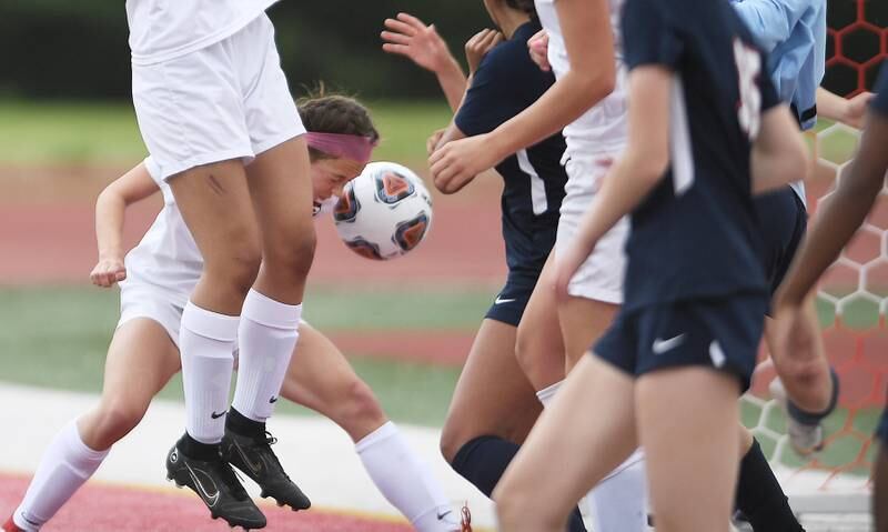 Lincoln-Way Central’s Emma Vogler, bends to head the ball into the net on a corner-kick for the first goal against Evanston in the Class 3A IHSA state girls soccer third-place game in Naperville on Saturday, June 4, 2022.
