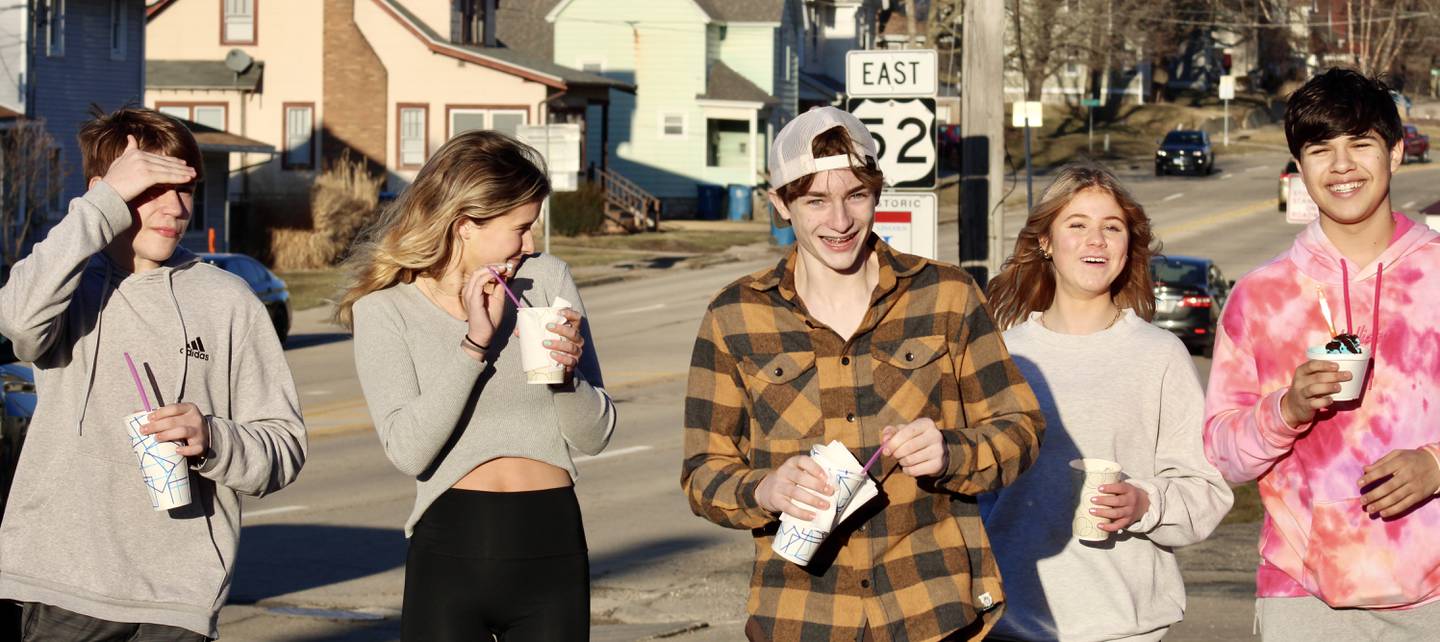 Students from Grand Detour walk along  Seventh Street in Dixon after stopping to get treats at Meusel's Dairy Delite on its opening day March 1, 2023. From left, Landen Cassens, Kamrynn Weaver, Carson Bivins, Emma Harrison and Bryce Nordan.
