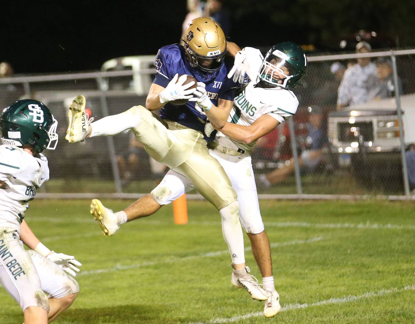 Marquette's Easton Debernardi comes up with a catch in the end zone over St. Bede's De Le Torre on Friday, Sept. 26, 2025 at Gould Stadium in Ottawa.