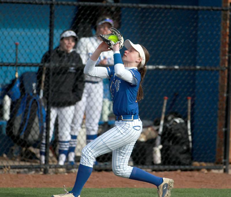 Wheaton North's Ava Hartnett catches a pop fly in foul territory during a game against St. Charles North on Tuesday, April 15, 2025 in St. Charles.