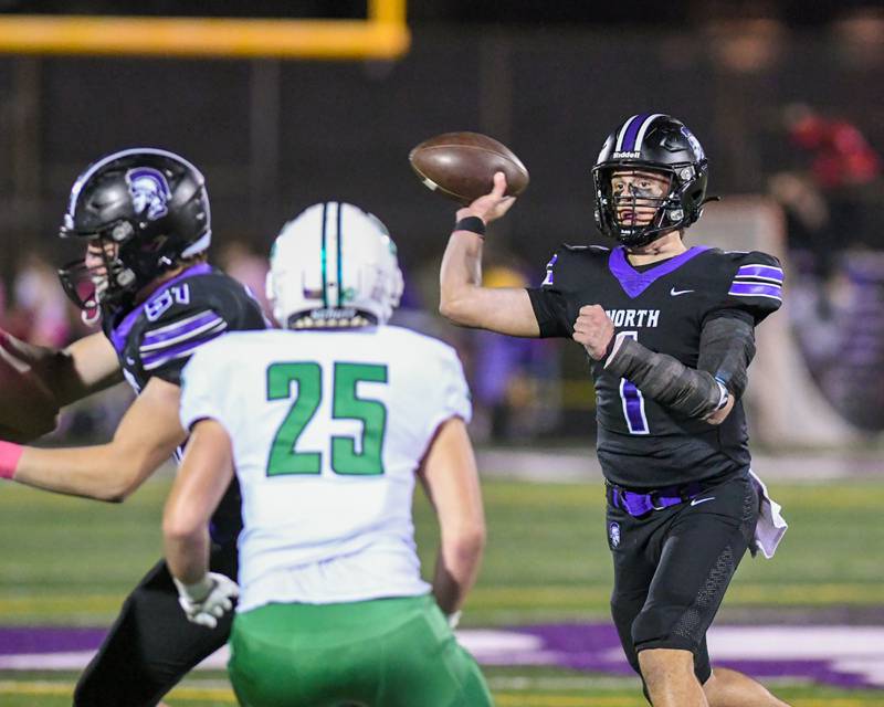 Downers Grove North's Owen Lansu (1) passes the ball during the game on Friday Oct. 10, 2025, while taking on York High School held at Downers Grove North High School.