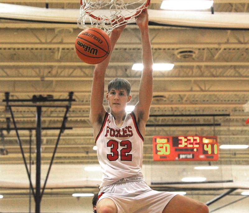 Yorkville's Jason Jakstys (32) slams the ball against Plainfield North during a boys’ varsity game at Yorkville High School on Tuesday, Nov. 29, 2022.