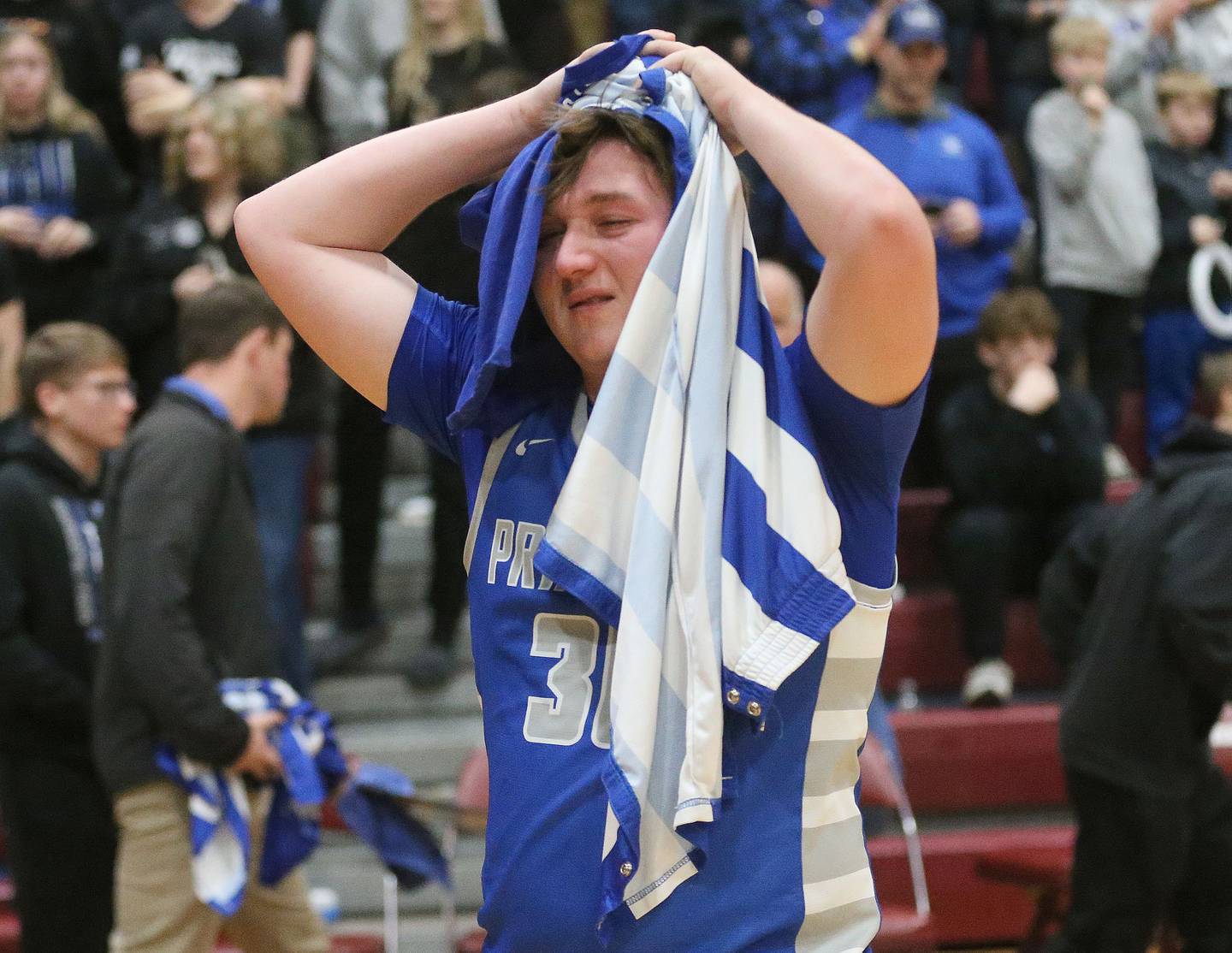 Princeton's Jordan Reinhardt reacts while walking off the floor  after loosing to Rock Falls during the Class 2A Sectional final on Friday, March 7, 2025 at Marengo High School.