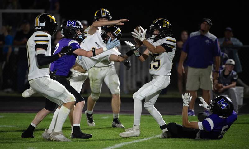 Herscher's Tanner Jones and Mason Roberts just miss an interception against Manteno on Friday, September 12, 2025.