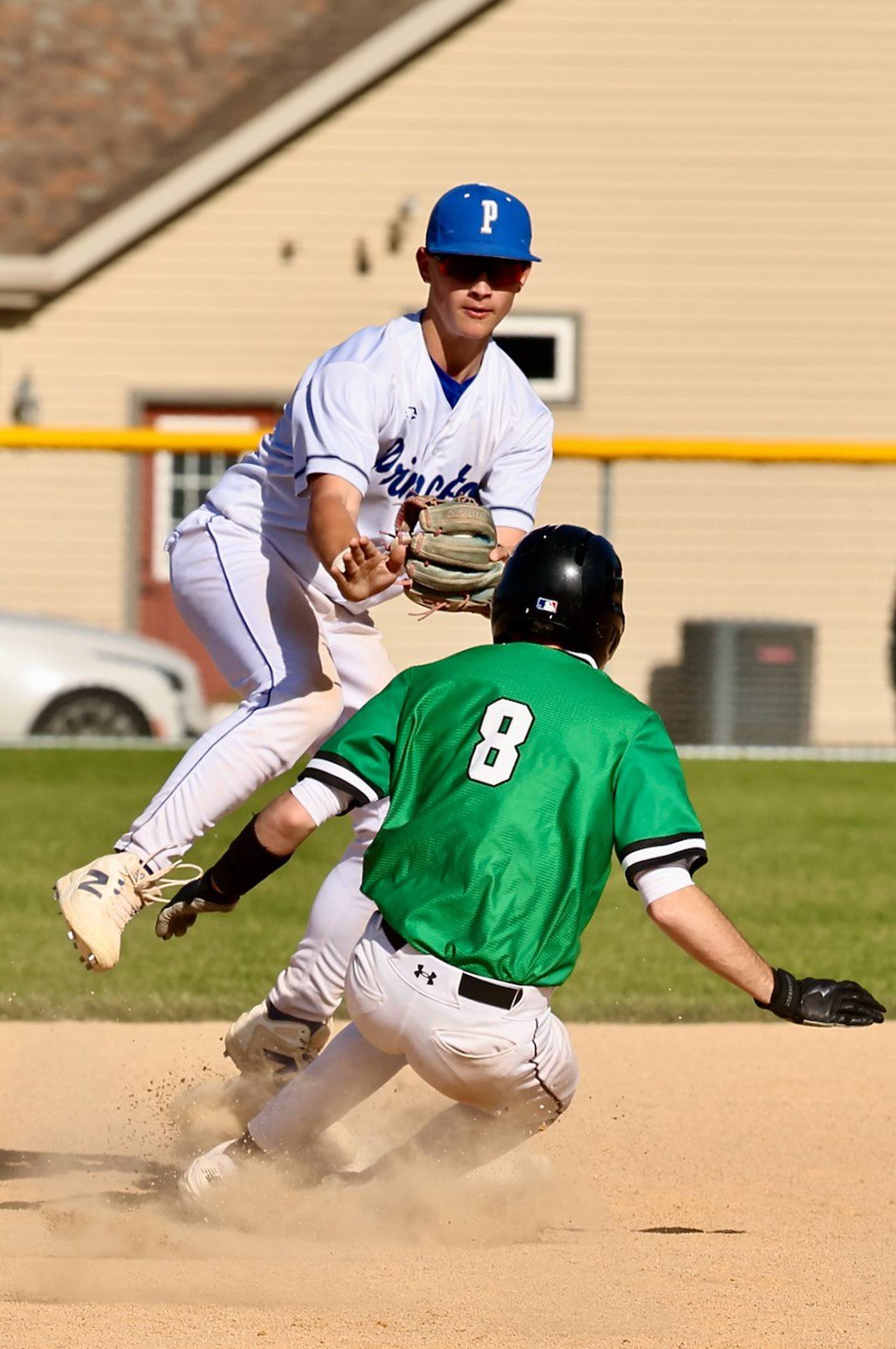 Princeton second baseman Brraden Shaw tags out Seneca's Griffin Hougas to complete a double play in Thursday's game at Prather Field in Princeton. The Irish won 8-6.
