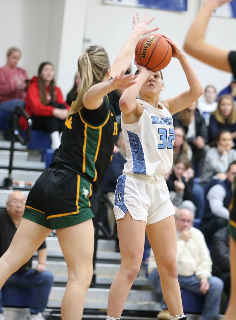 Nazareth's Stella Sakalas (32) takes a shot during the girls varsity basketball game between Fremd and Nazareth on Monday, Jan. 9, 2023 in La Grange Park, IL.