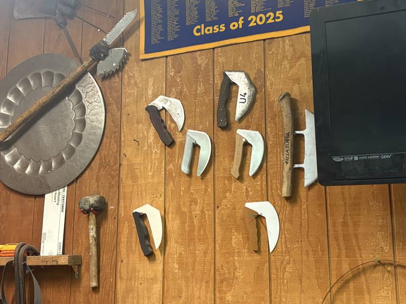 A collection of Ulu knives displayed in the garage workshop of Army veteran Doug Katz in Trout Valley.