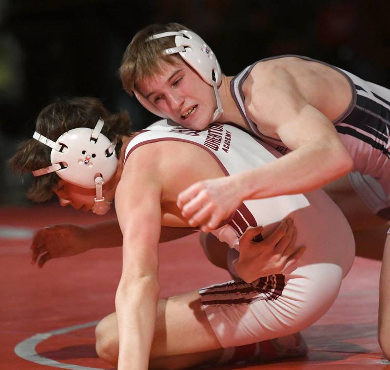 Yorkville Christian's Ty Edwards (top) wrestles Wheaton Academy's Lincoln Hoger in the championship match at 120 pounds during the 1A Oregon Wrestling Sectional on Saturday. Edwards won the match.