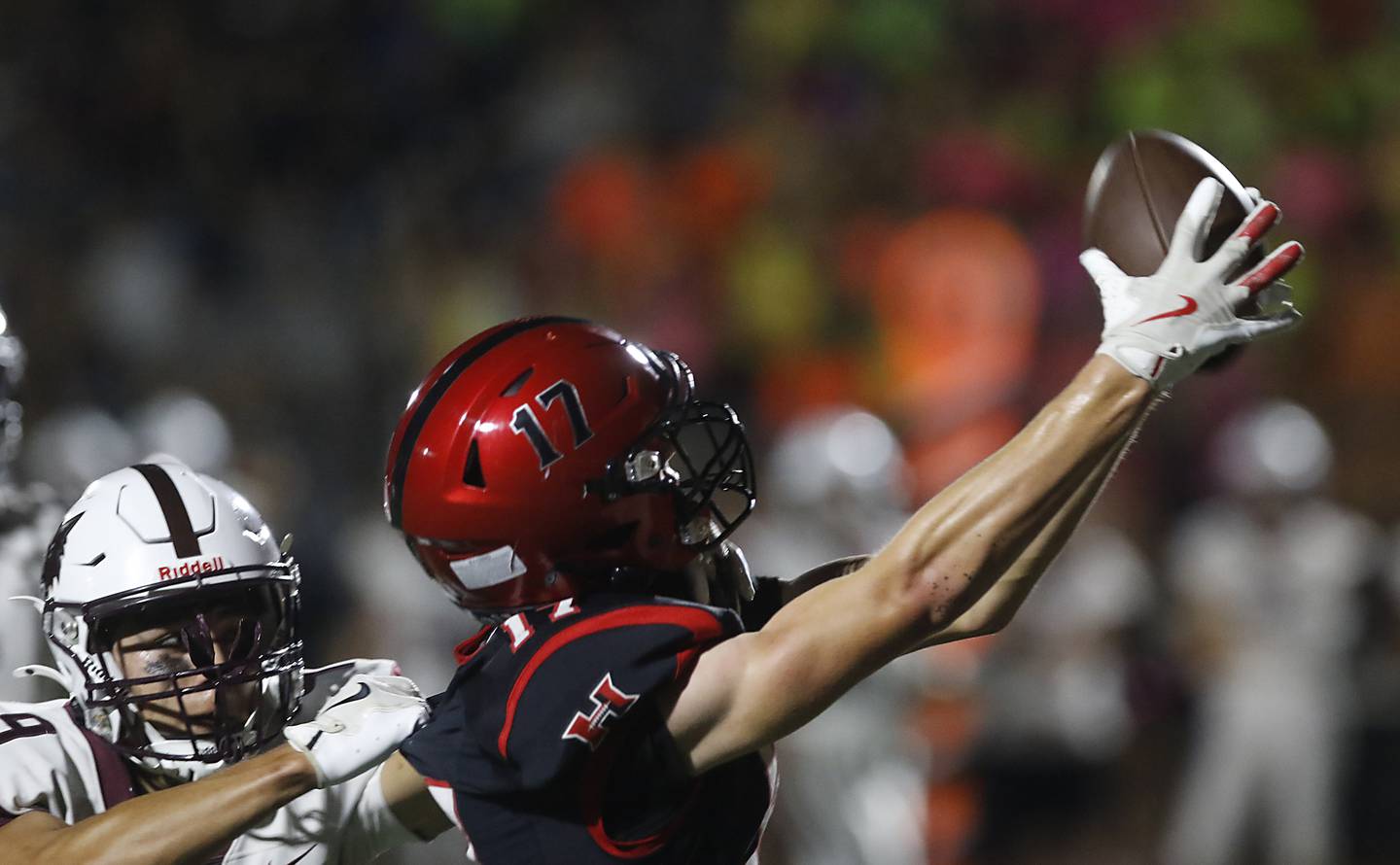 Huntley's Jacob Marx catches touchdown pass in front of Prairie Ridge's Alexander Trejo during a Fox Valley Conference football game on Friday, Oct. 3, 2025, at Huntley High School.