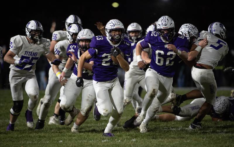 Wilmington's Hunter Kaitschuk, center, carries the ball on a play in the Class 2A semifinal against El Paso-Gridley on Saturday, November 22, 2025.
