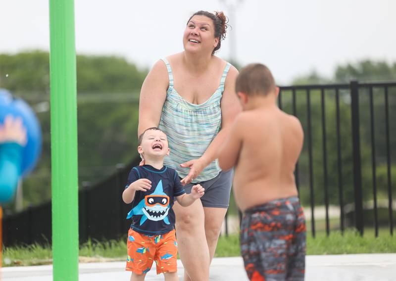 Kathy Bieser and her son Robbie, 2 years old, beat the heat by playing at Commissioners Park’s splash pad in Frankfort. Monday, June 13, 2022 in Frankfort.