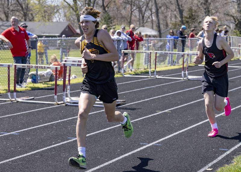 Putnam County's Cayden Bouxsein finishes strong for Putnam County to take home second in the 3200 meter race during the Rollie Morris Invite at Hall High School on April 13, 2024.